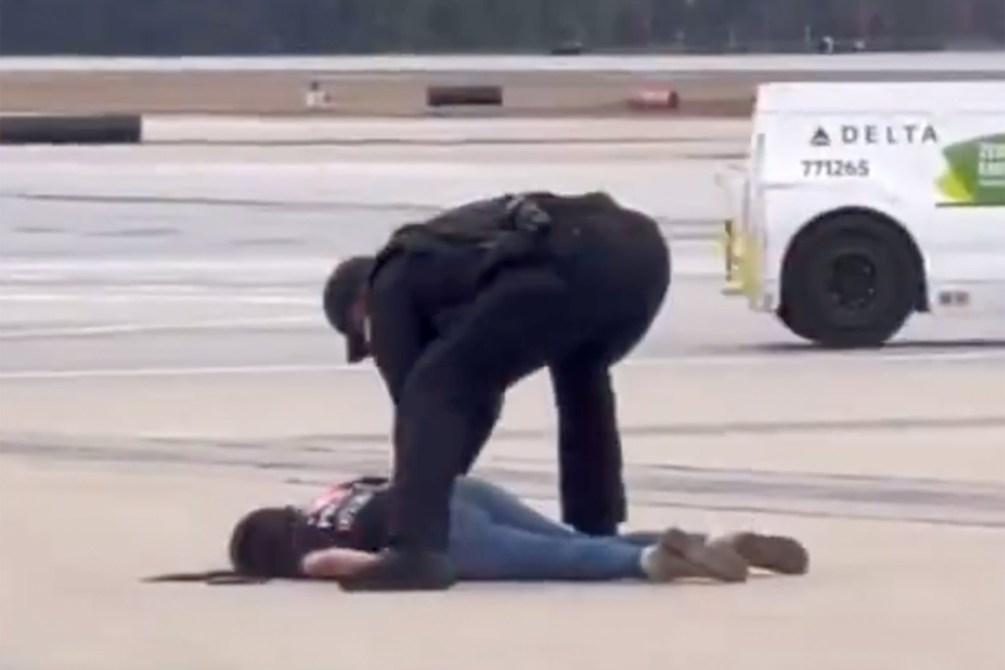 Woman shoved to ground at Atlanta airport by police before spitting